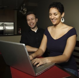 two people
using computer at home